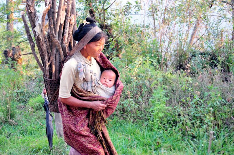 A woman is seen here in a village near Pungro, Kiphire, coming back from a hard day’s work at her field. As functional illiteracy in Nagaland remains high, people are unable to draw from the wealth of information and knowledge available in today’s world.